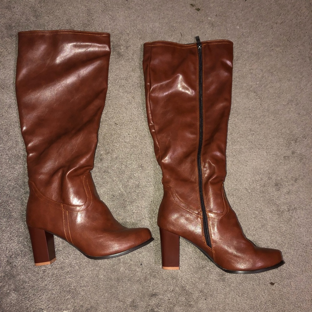 brown knee/calf high boots.